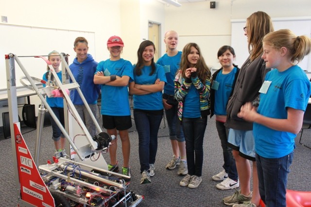 Blue campers learning about FIRST robotics